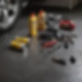 Essential tools for DIY oil change laid out on a garage floor