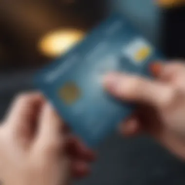 Close-up of a hand holding a credit card with a travel-themed background