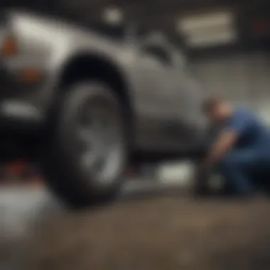 Mechanic examining the underbody of a car