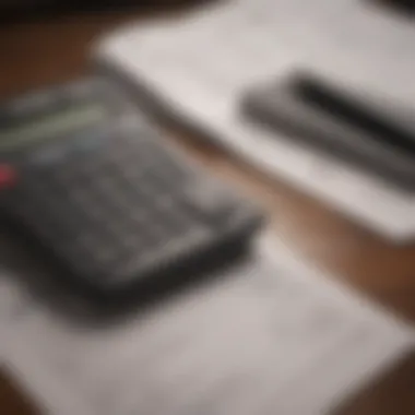 A close-up of a calculator with financial documents