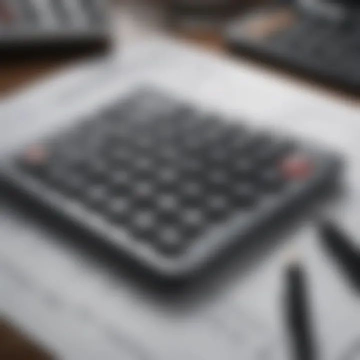 A close-up of a calculator and budgeting sheet