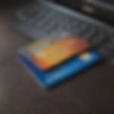 A close-up of a credit card and a computer screen