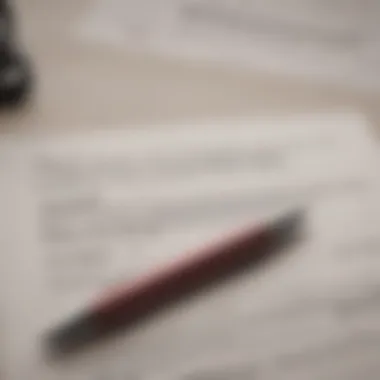 A close-up of rental agreement documents with a pen.