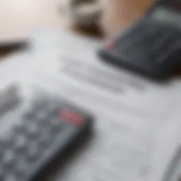 A close-up of a financial document with a calculator, symbolizing mortgage calculations.