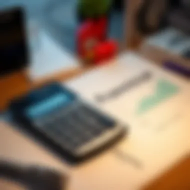 A calculator and financial documents on a desk.
