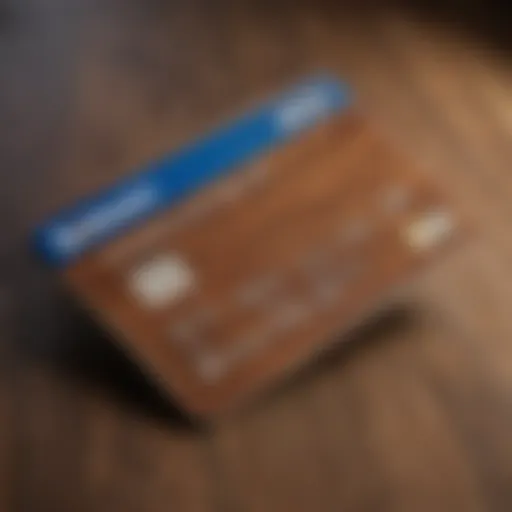 A close-up of a Lowe's credit card on a wooden surface, emphasizing its design and features.