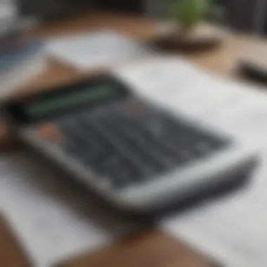 A close-up of a financial calculator and mortgage documents on a desk